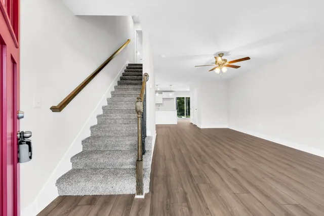 a view of entryway and hall with wooden floor