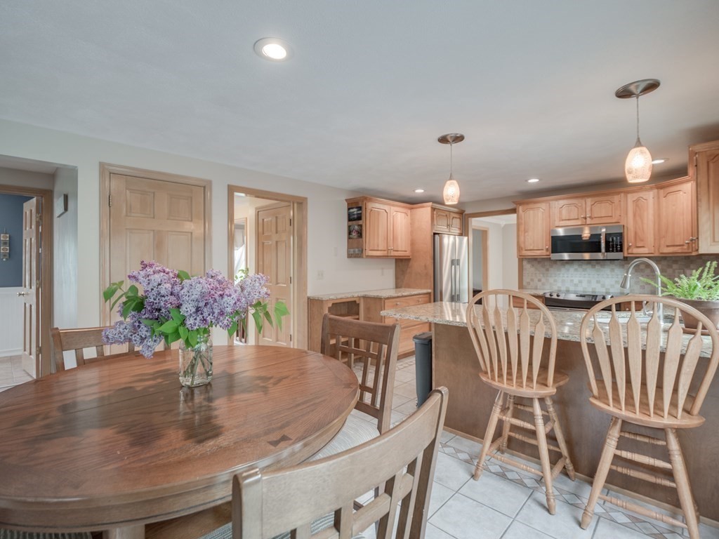 21 Scenic View Drive Pelham, NH 03076 - Photo 21 of 42 a dining room with furniture and wooden floor