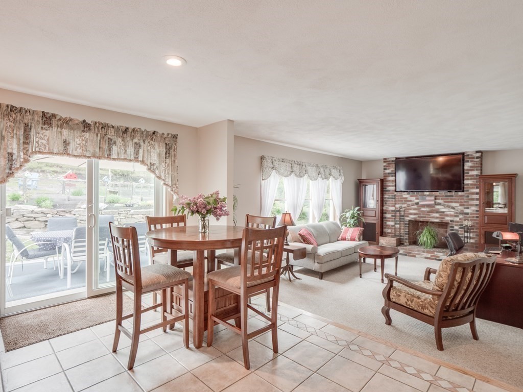 21 Scenic View Drive Pelham, NH 03076 - Photo 22 of 42 a dining room with furniture and a large window