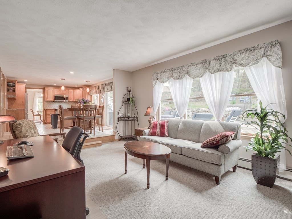 21 Scenic View Drive Pelham, NH 03076 - Photo 26 of 42 a living room with furniture and a large window