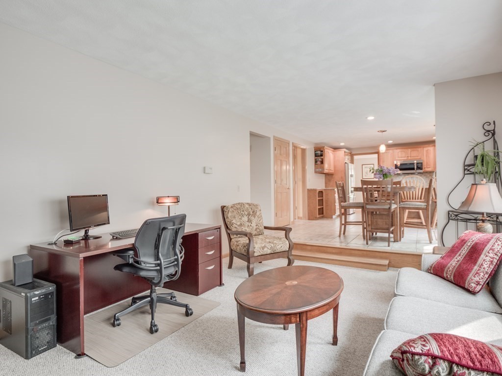 21 Scenic View Drive Pelham, NH 03076 - Photo 27 of 42 a work room with furniture a rug and a large window