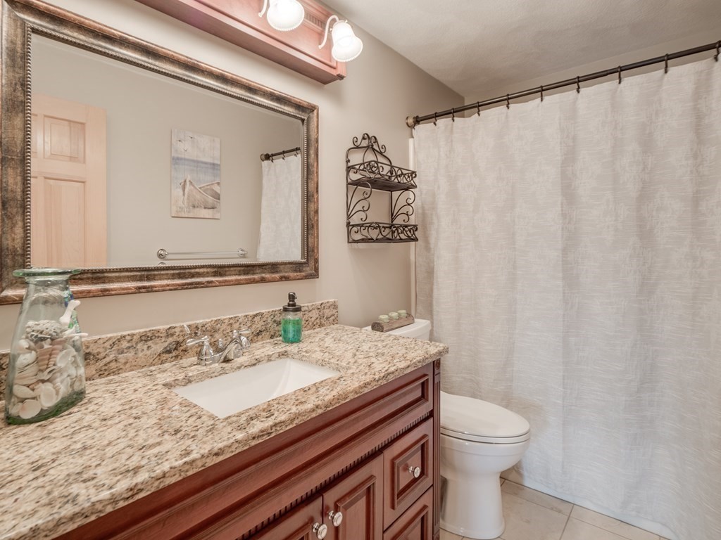 21 Scenic View Drive Pelham, NH 03076 - Photo 30 of 42 a bathroom with a granite countertop sink and a mirror