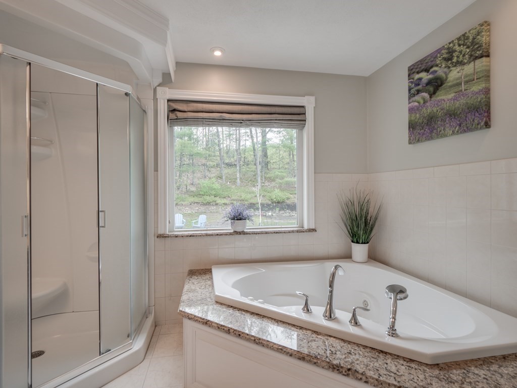 21 Scenic View Drive Pelham, NH 03076 - Photo 35 of 42 a bathroom with a tub and a window