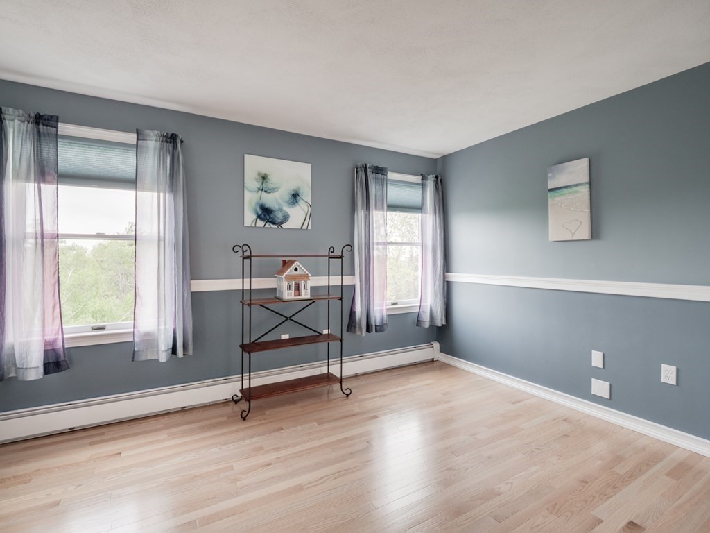 21 Scenic View Drive Pelham, NH 03076 - Photo 37 of 42 a view of a livingroom with wooden floor and a window