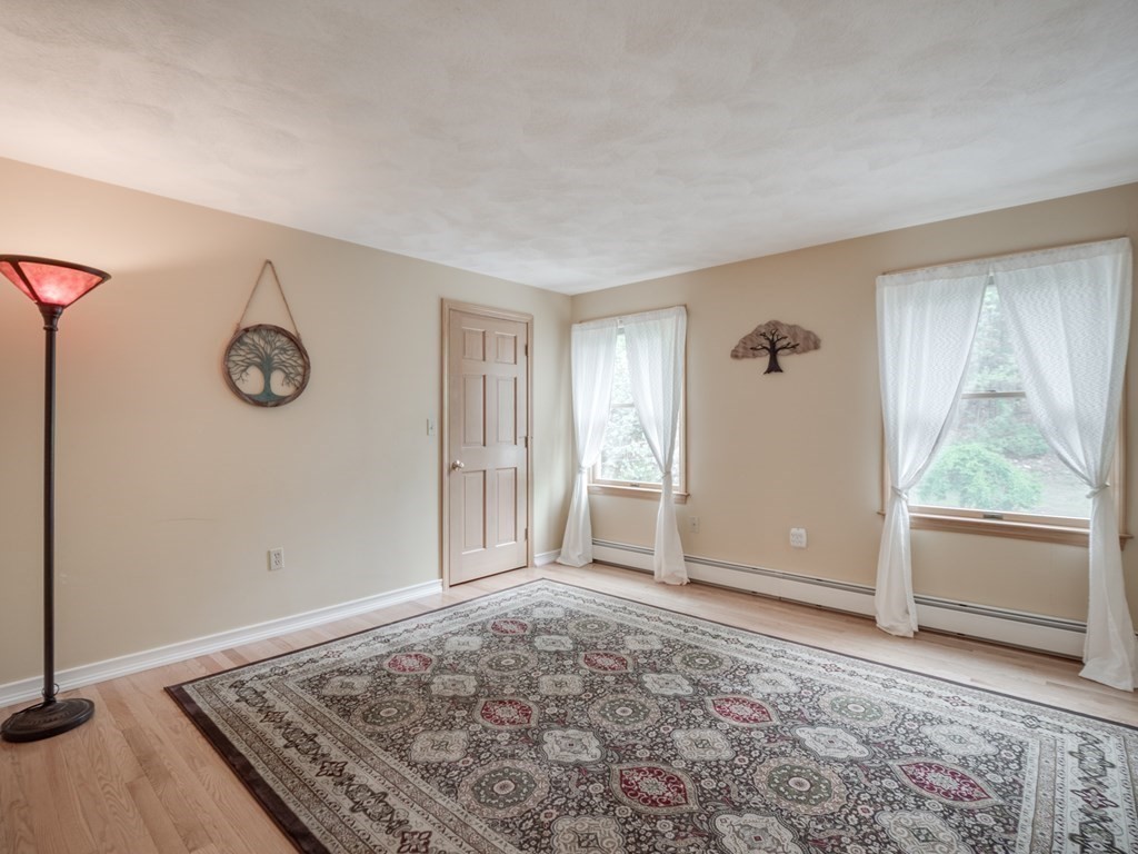 21 Scenic View Drive Pelham, NH 03076 - Photo 39 of 42 a view of an empty room with window and wooden floor