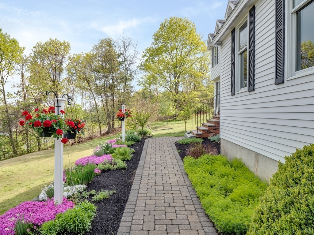 21 Scenic View Drive Pelham, NH 03076 - Photo 4 of 42 a view of a garden with flowers and flowers