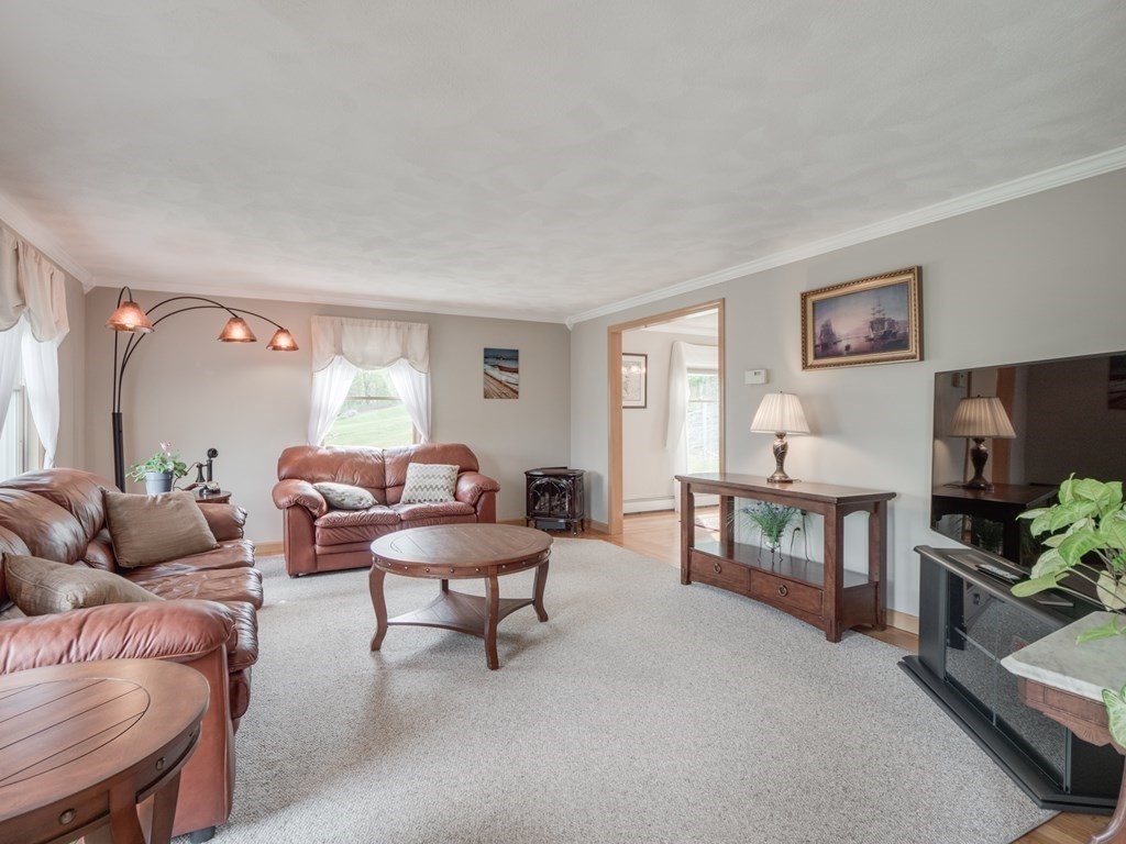 21 Scenic View Drive Pelham, NH 03076 - Photo 8 of 42 a living room with furniture and a flat screen tv