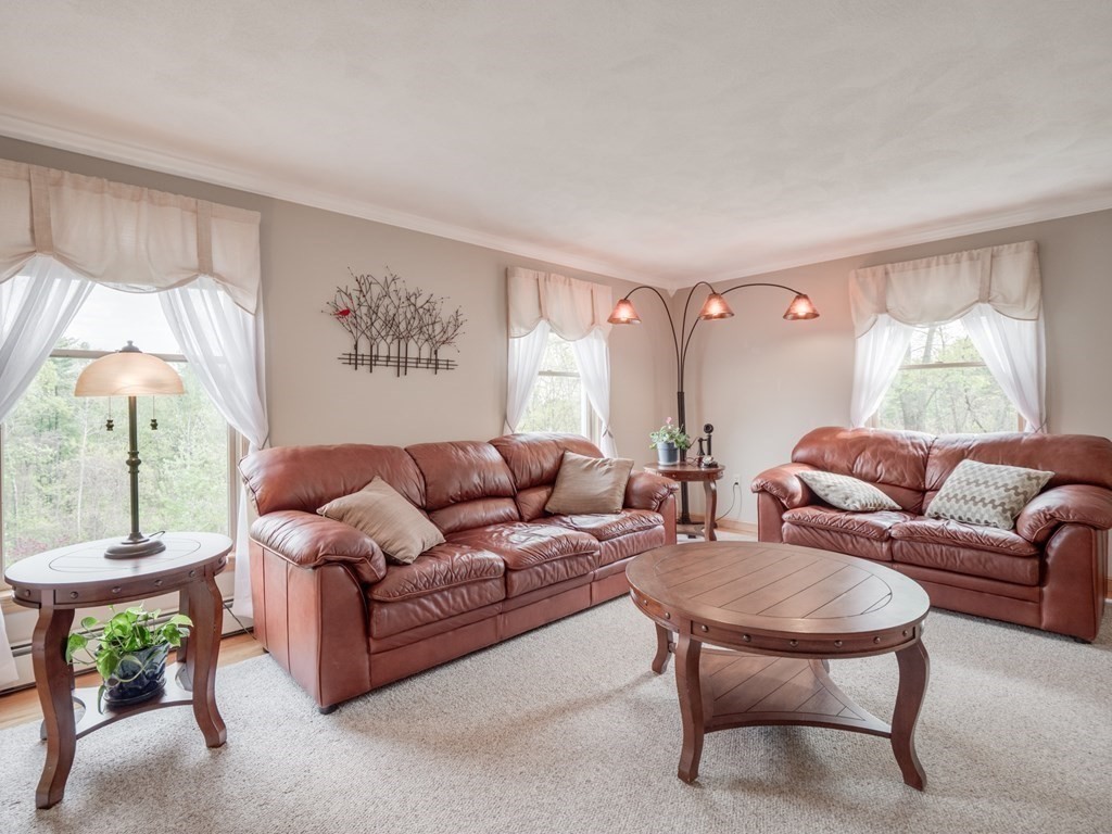 21 Scenic View Drive Pelham, NH 03076 - Photo 9 of 42 a living room with furniture and a large window