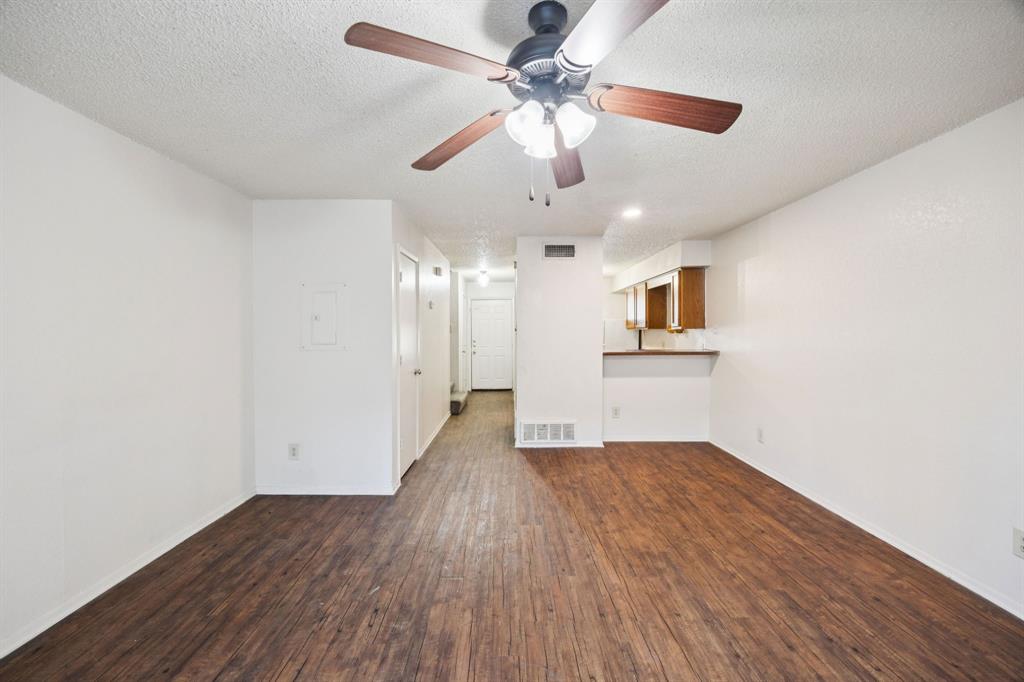 8109 Silver Creek Road, Unit B White Settlement, TX 76108 - Photo 11 of 28 wooden floor in an empty room with a window