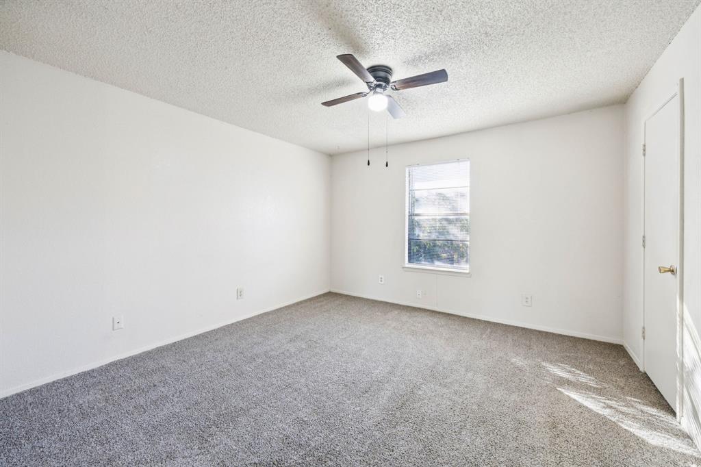 8109 Silver Creek Road, Unit B White Settlement, TX 76108 - Photo 13 of 28 an empty room with a window and a fan