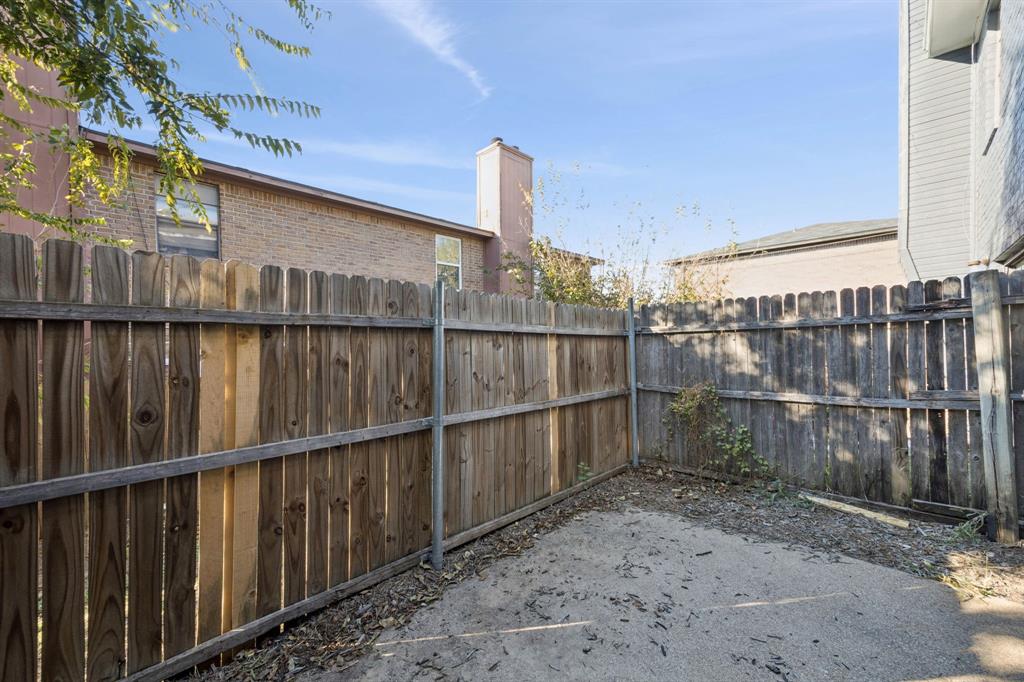 8109 Silver Creek Road, Unit B White Settlement, TX 76108 - Photo 24 of 28 a view of a wooden house with a wooden fence