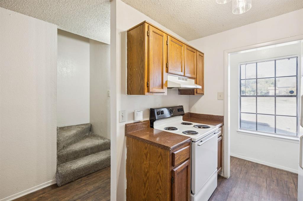 8109 Silver Creek Road, Unit B White Settlement, TX 76108 - Photo 5 of 28 a utility room with cabinets washer and dryer