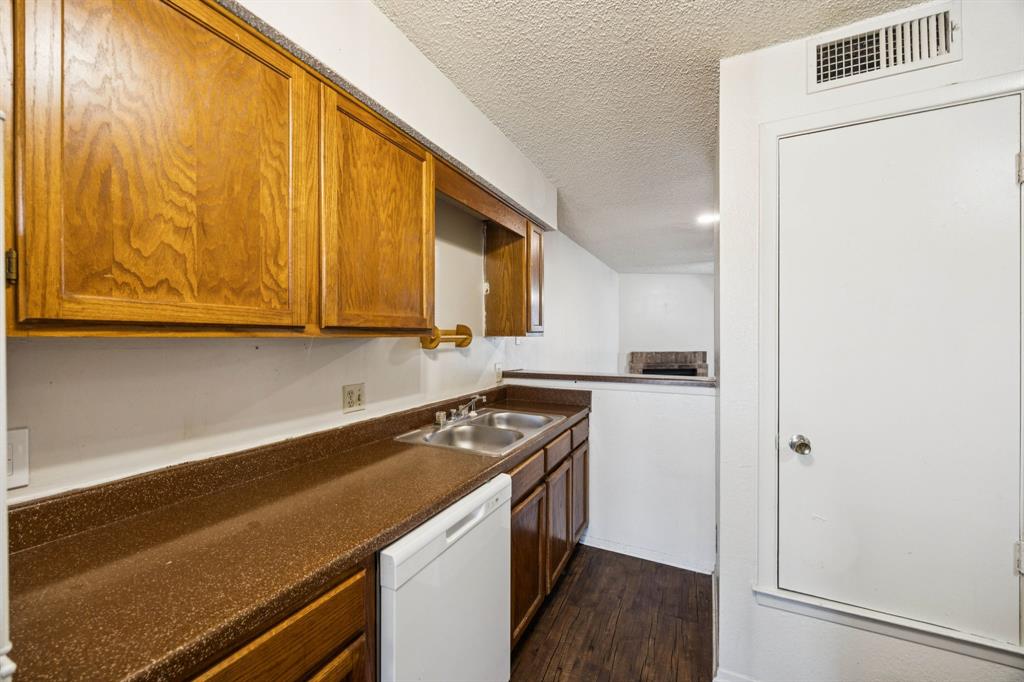 8109 Silver Creek Road, Unit B White Settlement, TX 76108 - Photo 8 of 28 a kitchen with a stove and a refrigerator