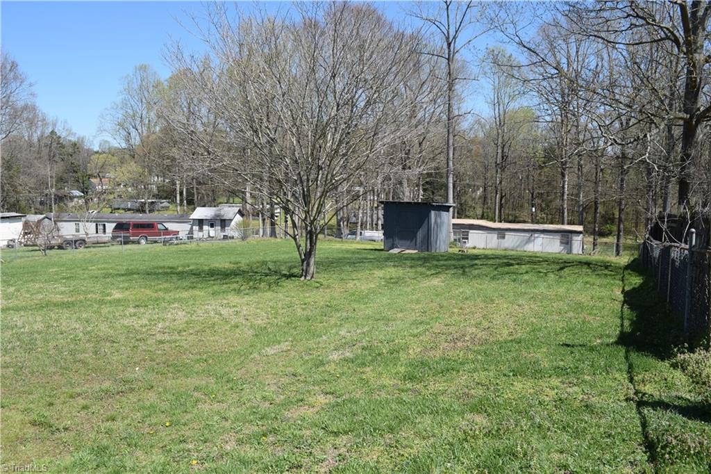 217 Wintbrook Road Thomasville, NC 27360 - Photo 12 of 15 Back yard with storage building and completely fenced