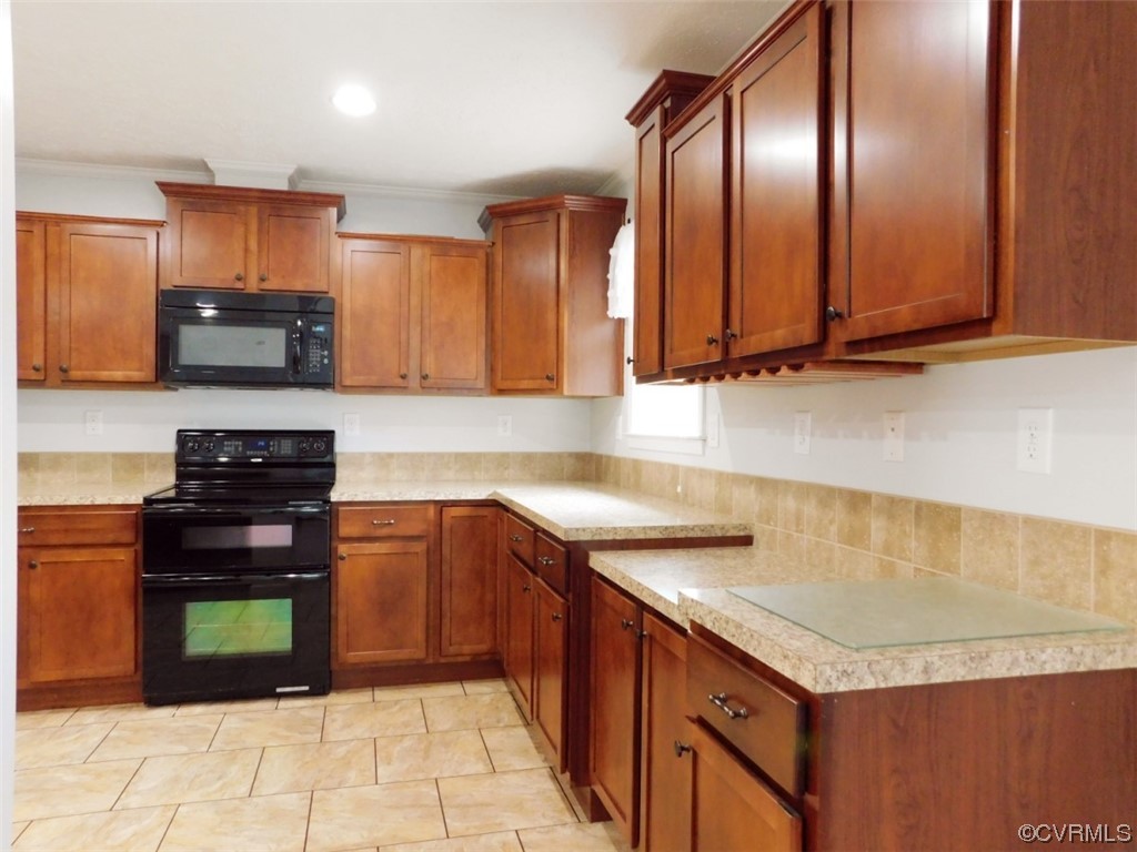 109 Jay's Road Farmville, VA 23901 - Photo 2 of 31 a kitchen with stainless steel appliances granite countertop a stove a sink and a microwave