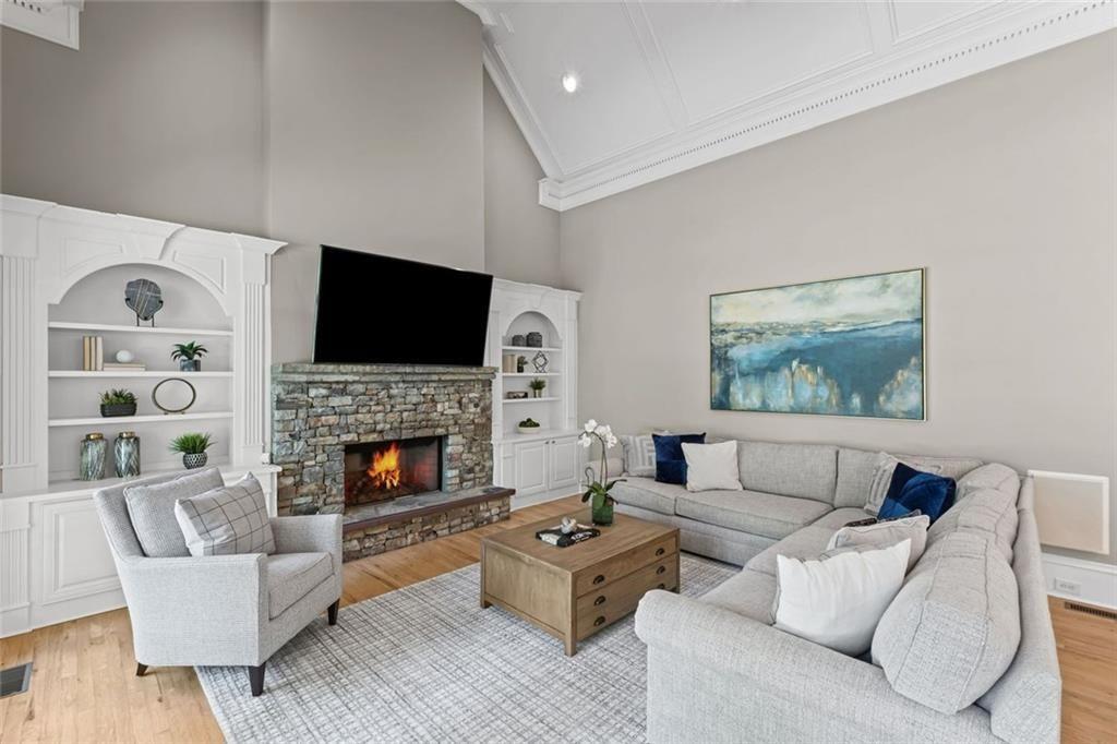 2281 Bransley Place Duluth, GA 30097 - Photo 20 of 70 a living room with furniture fireplace and a flat screen tv