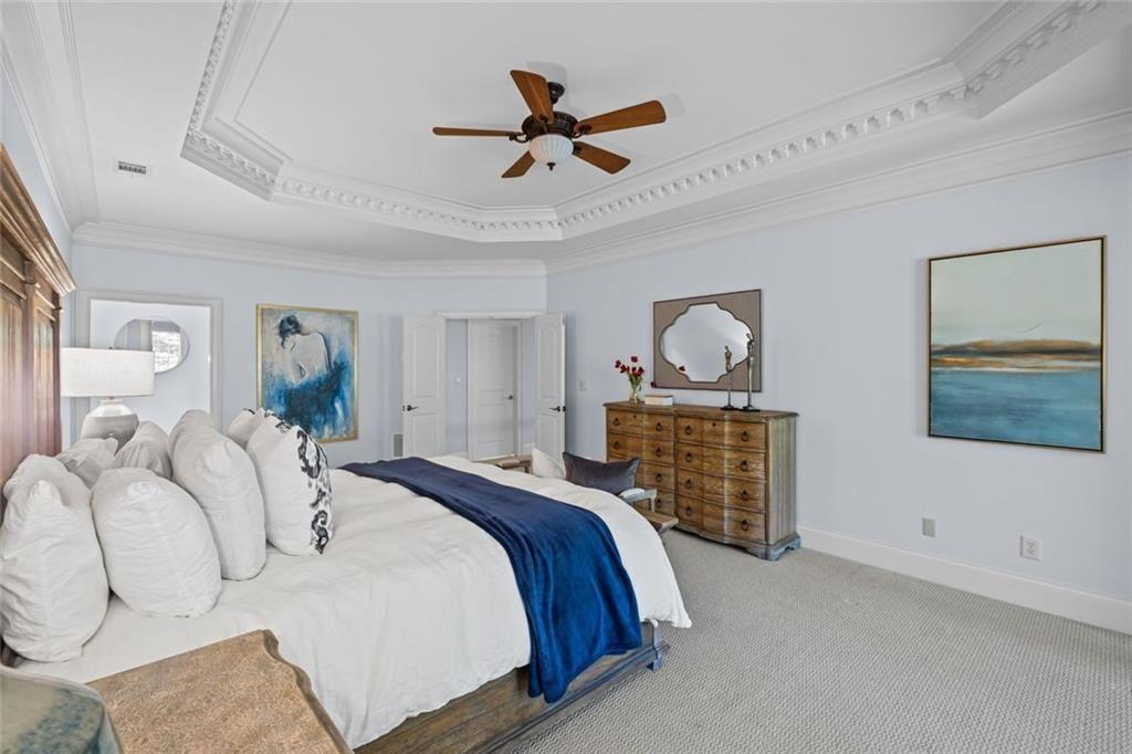 2281 Bransley Place Duluth, GA 30097 - Photo 32 of 70 a bedroom with a bed and ceiling fan