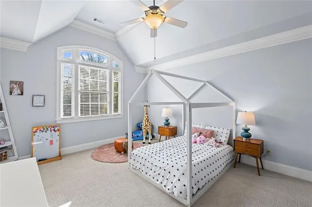 a living room with a table and chairs