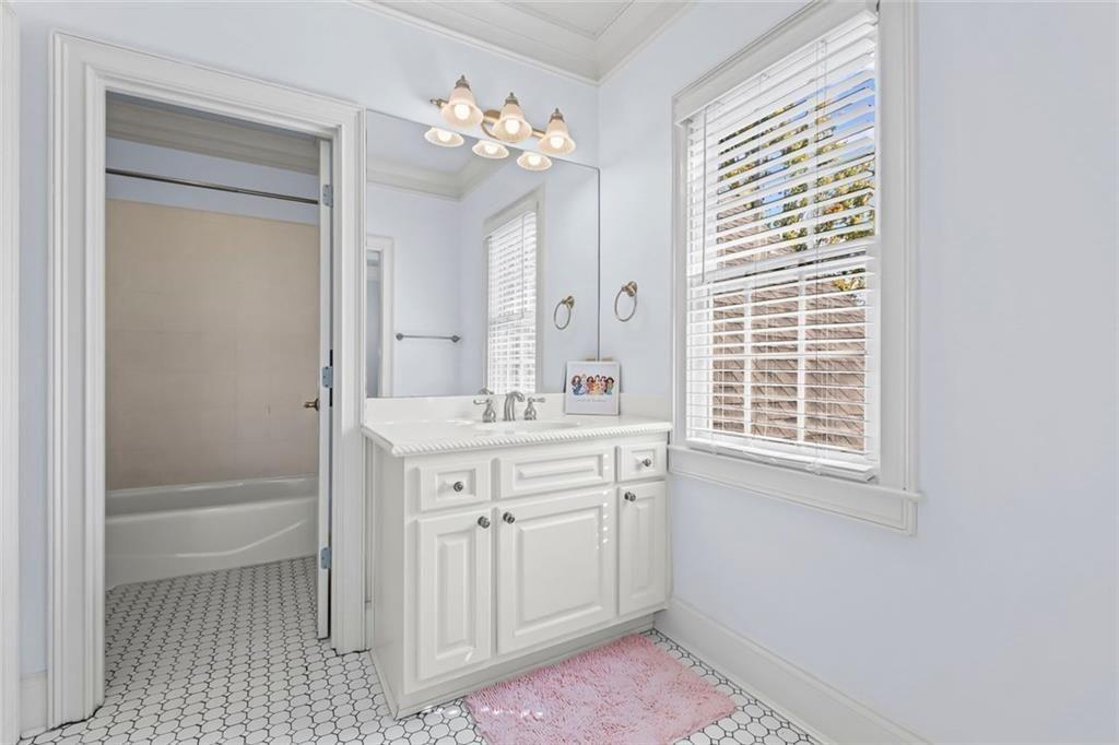 2281 Bransley Place Duluth, GA 30097 - Photo 40 of 70 a bathroom with a sink a vanity and a mirror