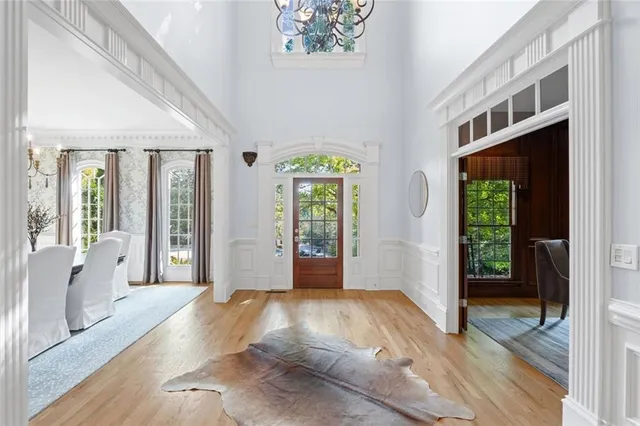 a view of an entryway with wooden floor and garden