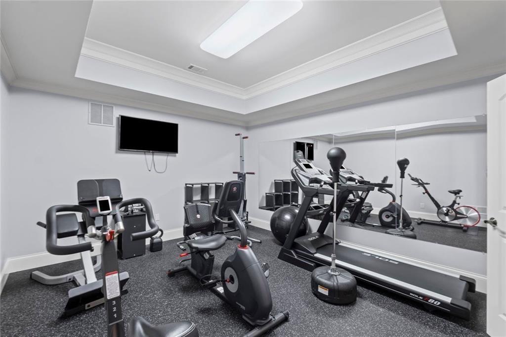 2281 Bransley Place Duluth, GA 30097 - Photo 52 of 70 a view of a room with gym equipment