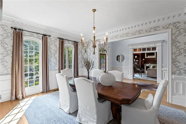 a view of a dining room with furniture window and wooden floor
