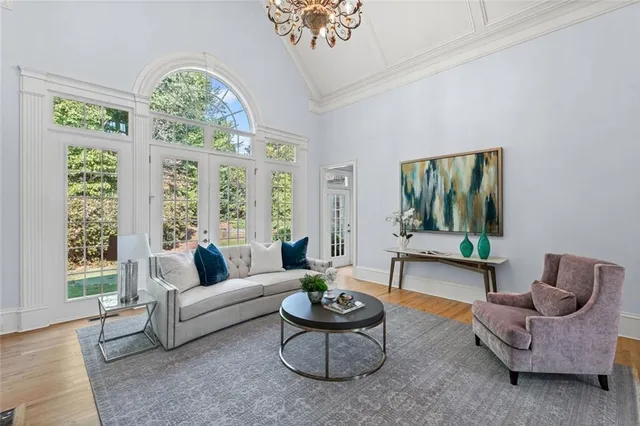 a view of living room with kitchen island furniture and wooden floor