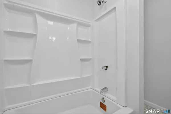 a view of a hallway with washer and dryer