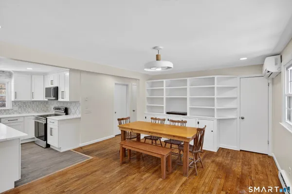 a room with furniture and wooden floor