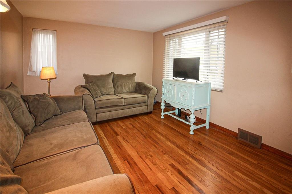 164 Gill Hall Road Clairton, PA 15025 - Photo 5 of 30 a living room with furniture and a flat screen tv