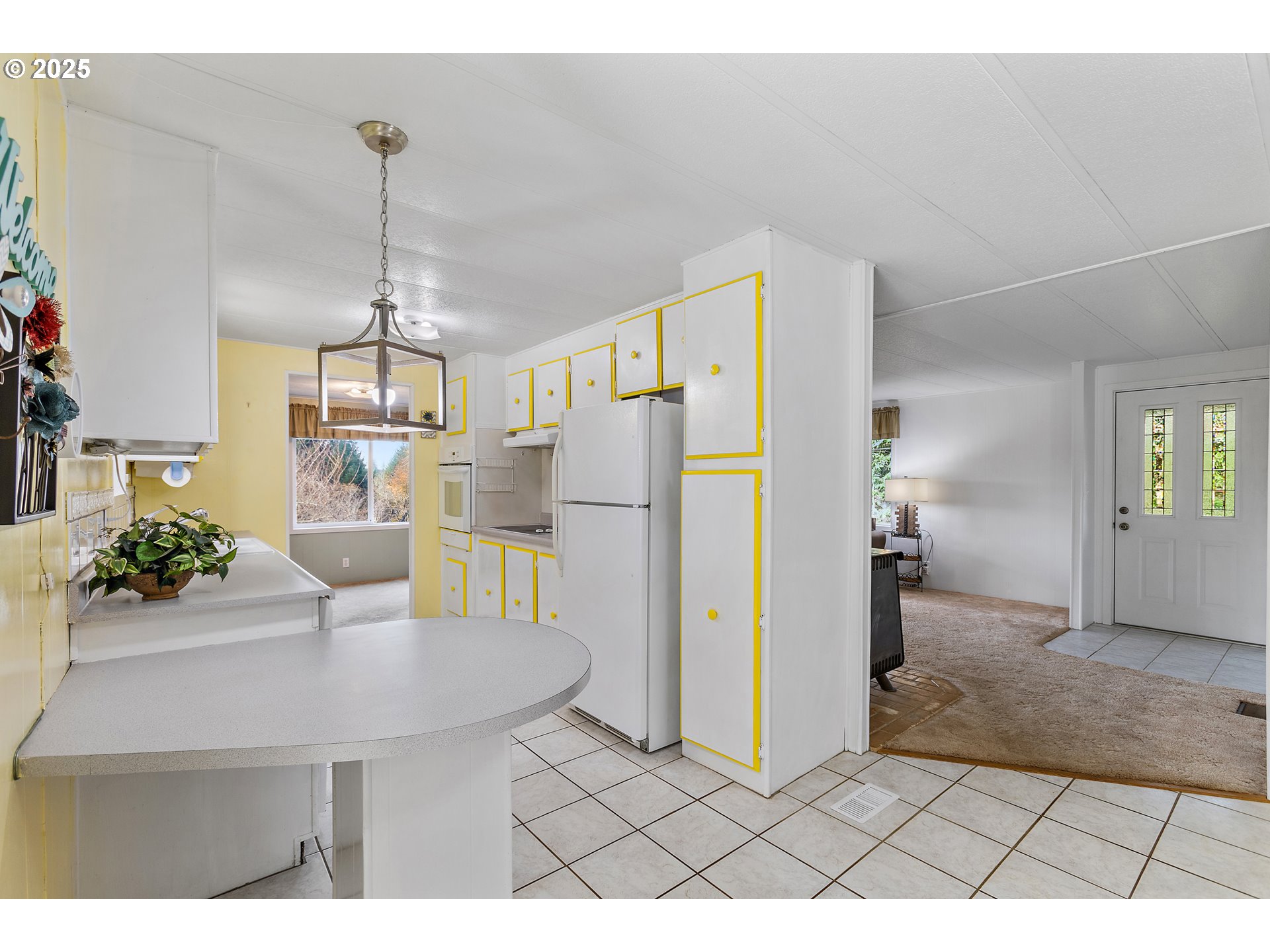 1782 Cole Road South Salem, OR 97306 - Photo 5 of 43 a kitchen with stainless steel appliances kitchen island granite countertop a refrigerator and a sink