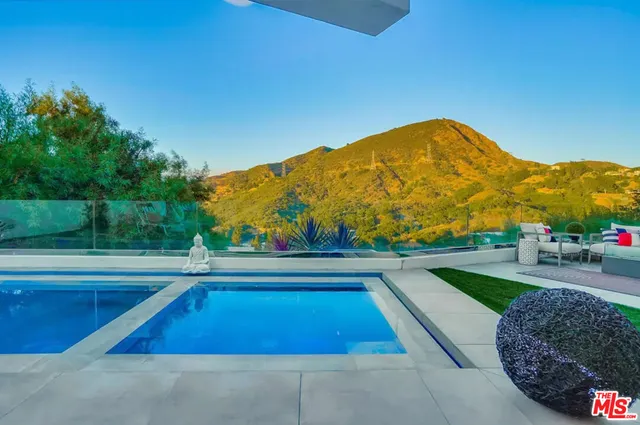 a bathroom with a shower and a sink