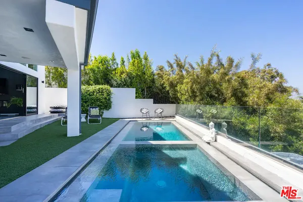 a view of a backyard with potted plants