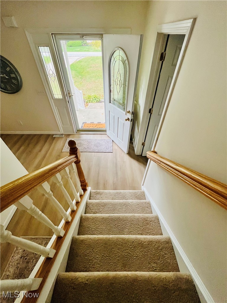 3811 Center Road Perry, OH 44081 - Photo 12 of 50 Stairway with wood finished floors and baseboards