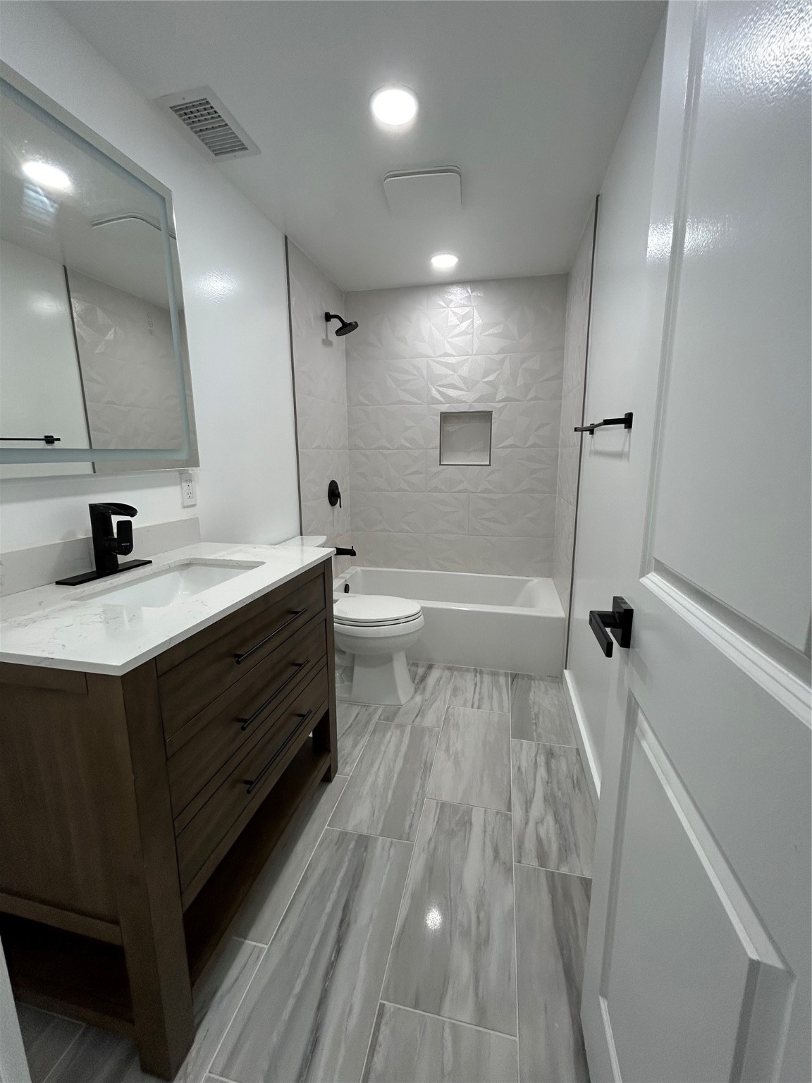 8523 Riverside Walk Lane Houston, TX 77064 - Photo 15 of 24 a bathroom with a double vanity sink a toilet and a mirror
