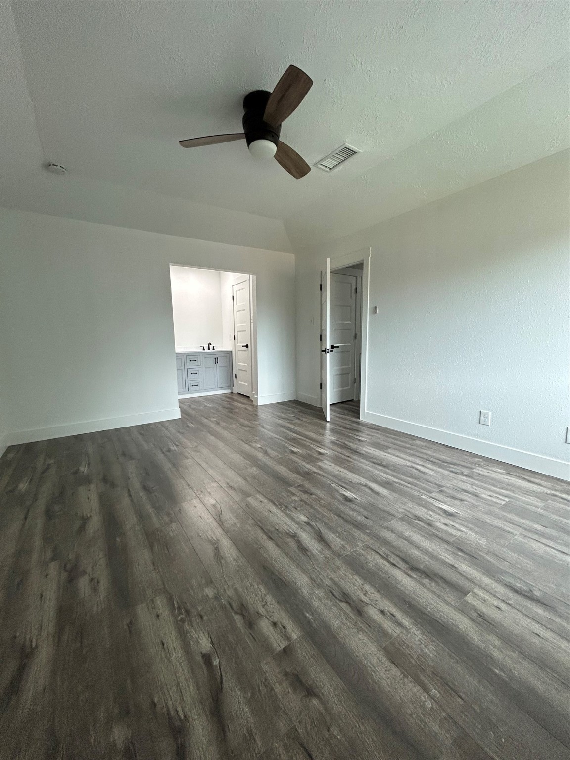 8523 Riverside Walk Lane Houston, TX 77064 - Photo 9 of 24 an empty room with wooden floor ceiling fan and window