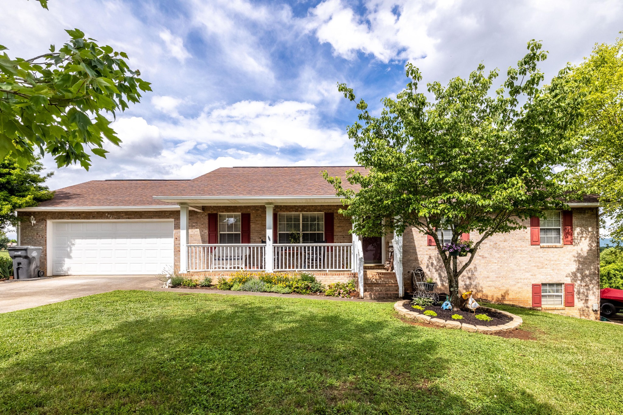442 Wilaway Road Maryville, TN 37801 - Photo 1 of 37 a front view of a house with a garden and yard