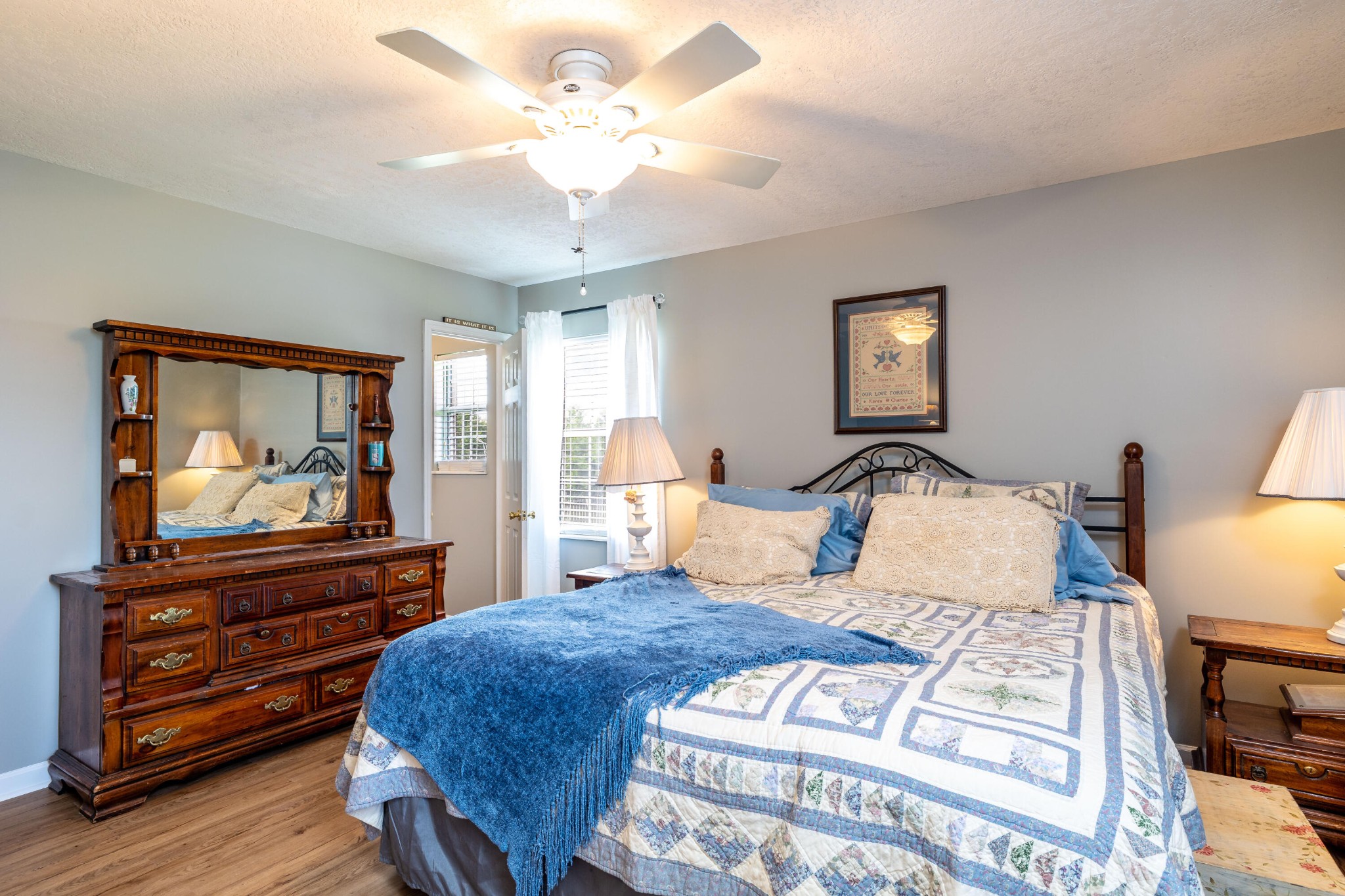 442 Wilaway Road Maryville, TN 37801 - Photo 22 of 37 a bedroom with a bed a dresser and wooden floor