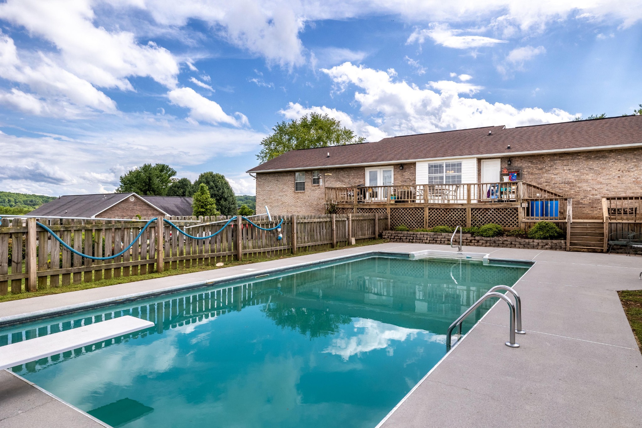 442 Wilaway Road Maryville, TN 37801 - Photo 32 of 37 a view of a house with swimming pool and sitting area