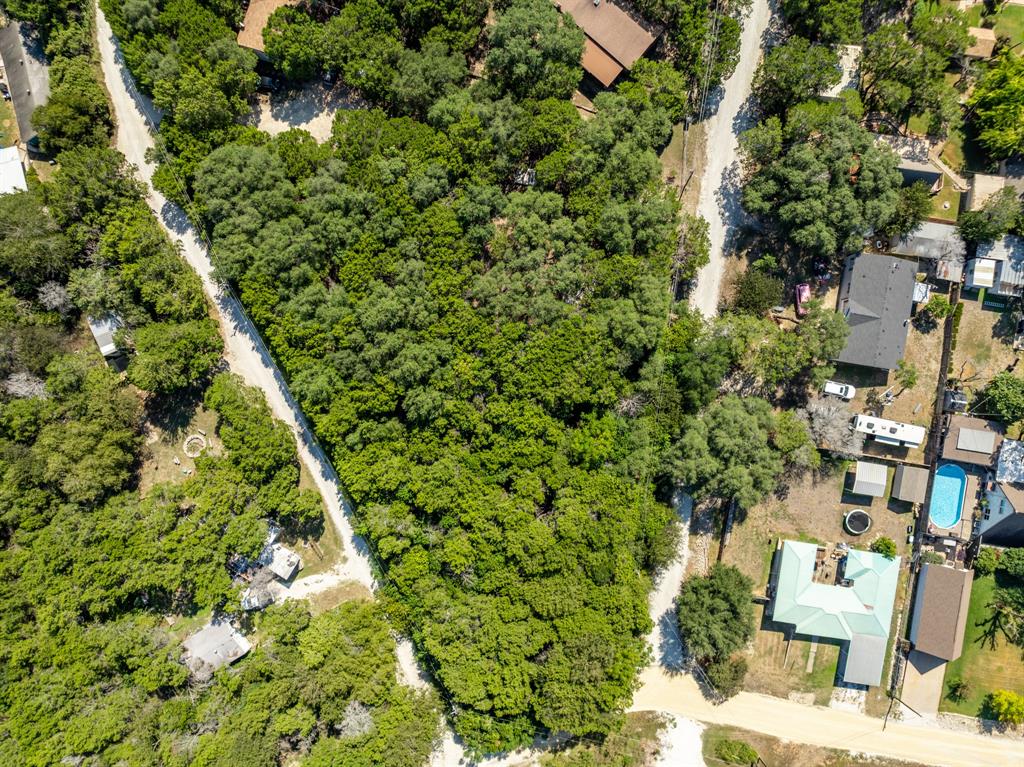 Tbd Palamino Loop Whitney, TX 76692 - Photo 4 of 18 an aerial view of residential house with outdoor space and trees all around