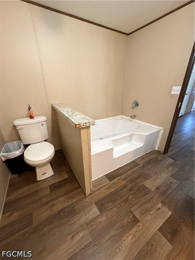 631 Stanton Street Clewiston, FL 33440 - Photo 12 of 24 a bathroom with a white toilet and a sink