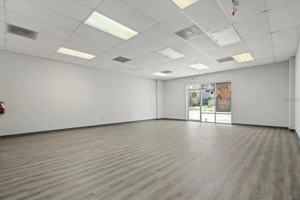 an empty room with wooden floor