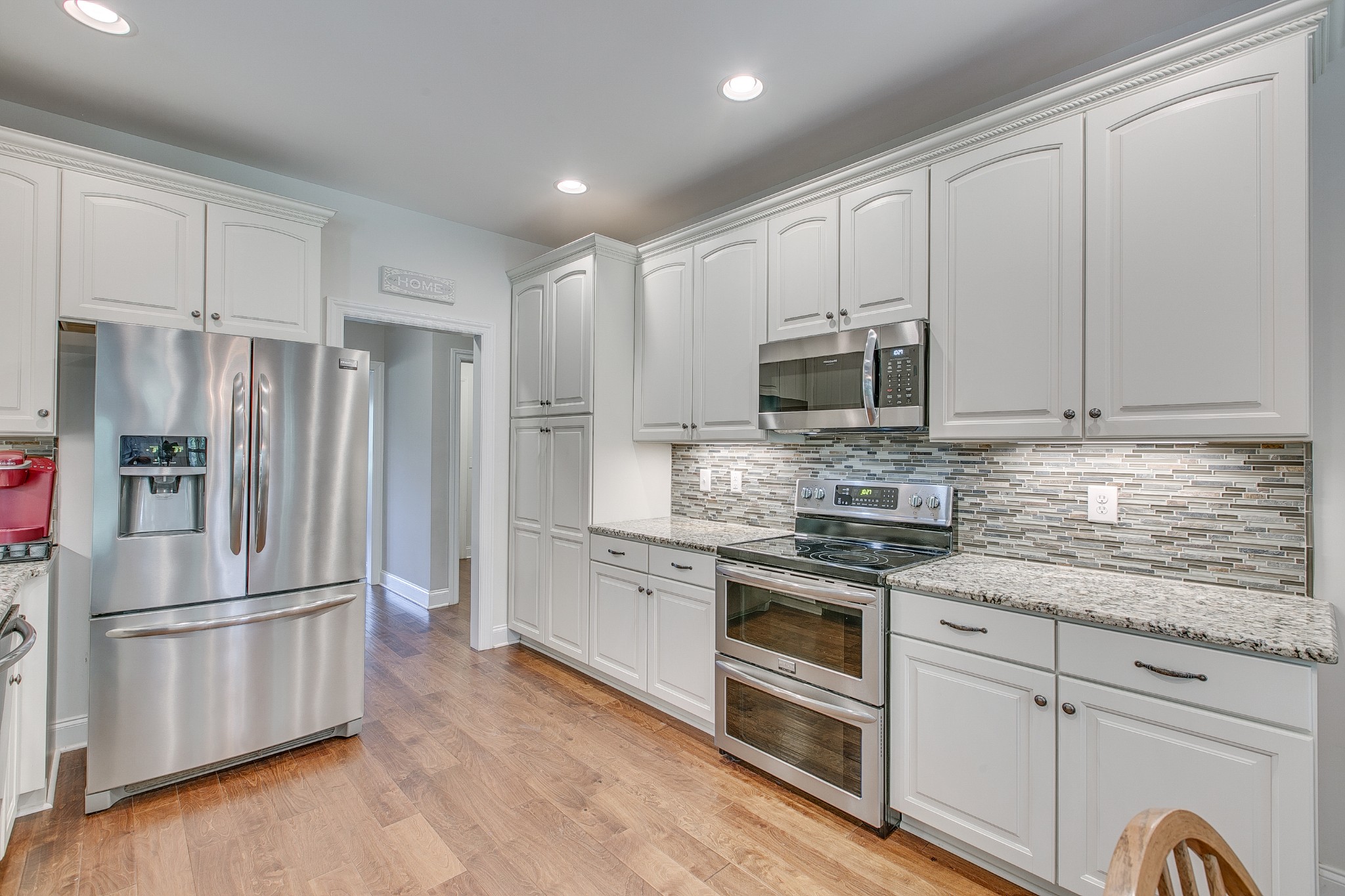 8798 Link Road Christiana, TN 37037 - Photo 17 of 32 a kitchen with stainless steel appliances granite countertop a refrigerator microwave and sink
