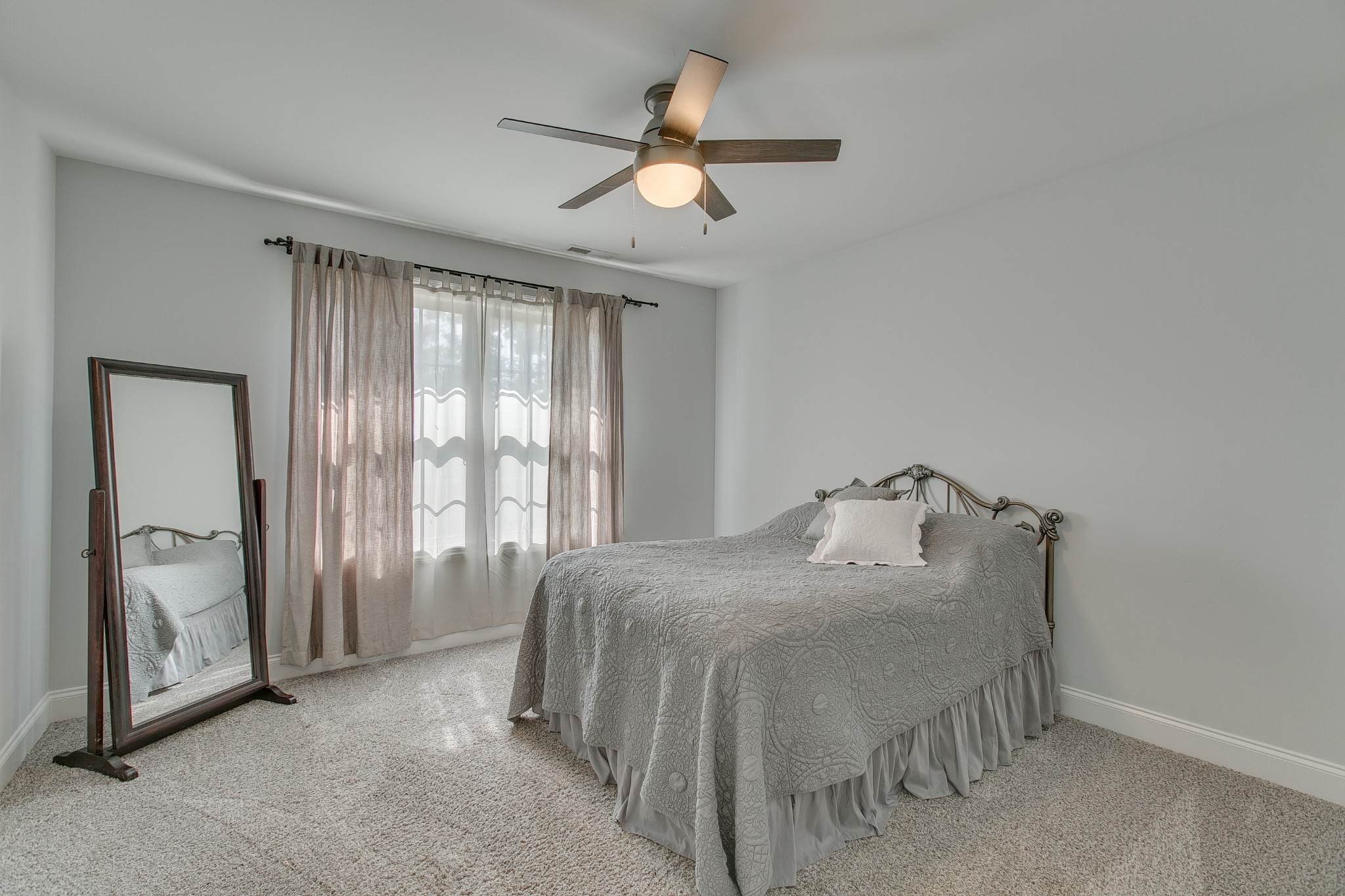 8798 Link Road Christiana, TN 37037 - Photo 27 of 32 a bed sitting in a spacious bedroom next to a window
