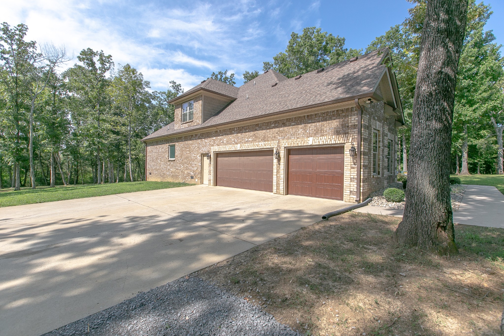 8798 Link Road Christiana, TN 37037 - Photo 3 of 32 a view of a house with a yard and garage
