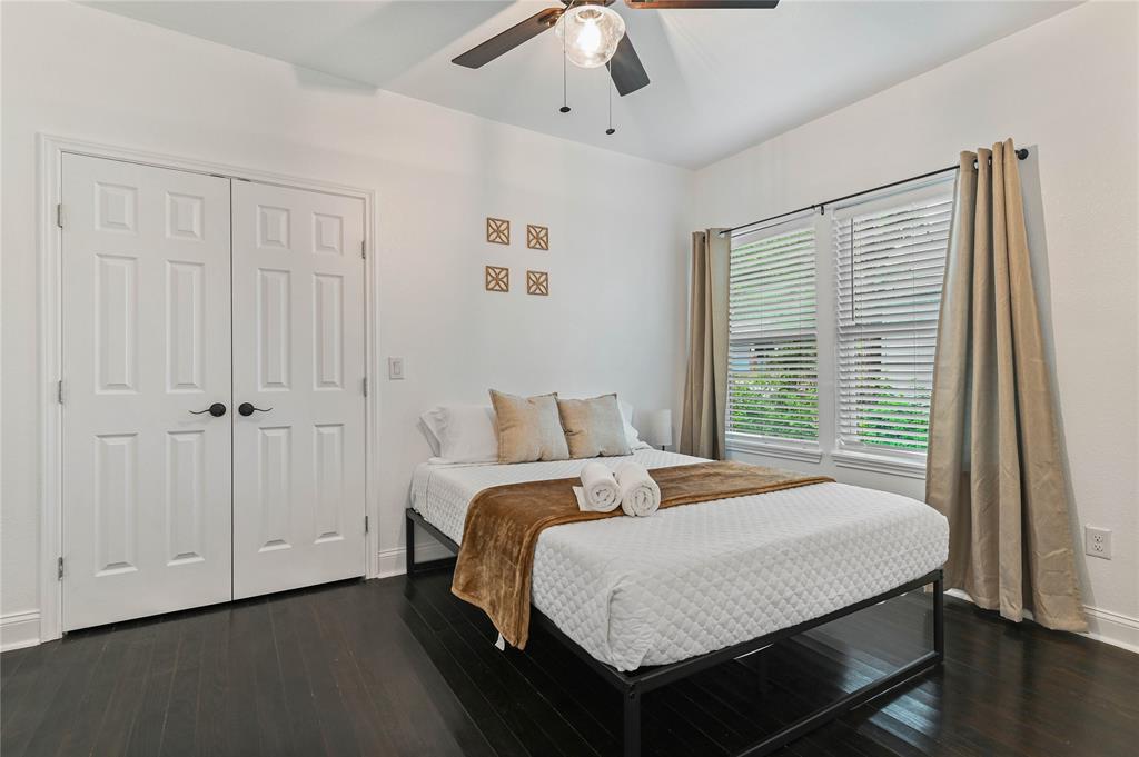 1106 West Chestnut Street Denison, TX 75020 - Photo 29 of 38 Bedroom with dark wood-type flooring, a closet, and ceiling fan