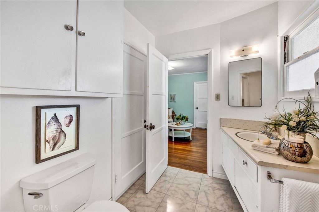 1722 North Flower Street Santa Ana, CA 92706 - Photo 15 of 25 a spacious bathroom with a sink a mirror and a bathtub