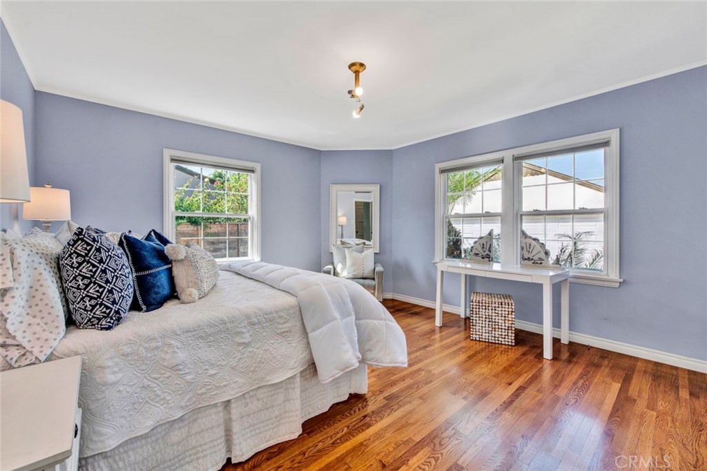 1722 North Flower Street Santa Ana, CA 92706 - Photo 16 of 25 a bedroom with a bed and a table lamp