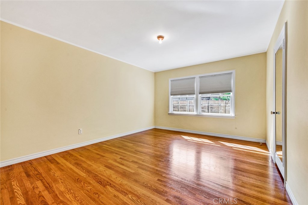 1722 North Flower Street Santa Ana, CA 92706 - Photo 20 of 25 a view of an empty room with wooden floor
