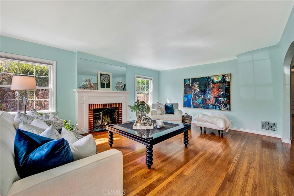 1722 North Flower Street Santa Ana, CA 92706 - Photo 6 of 25 a living room with furniture a fireplace and a large window